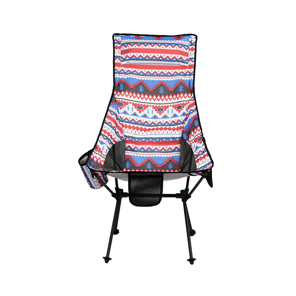 Red aluminium alloy folding moon chair unfolded on grass with folding mechanism visible