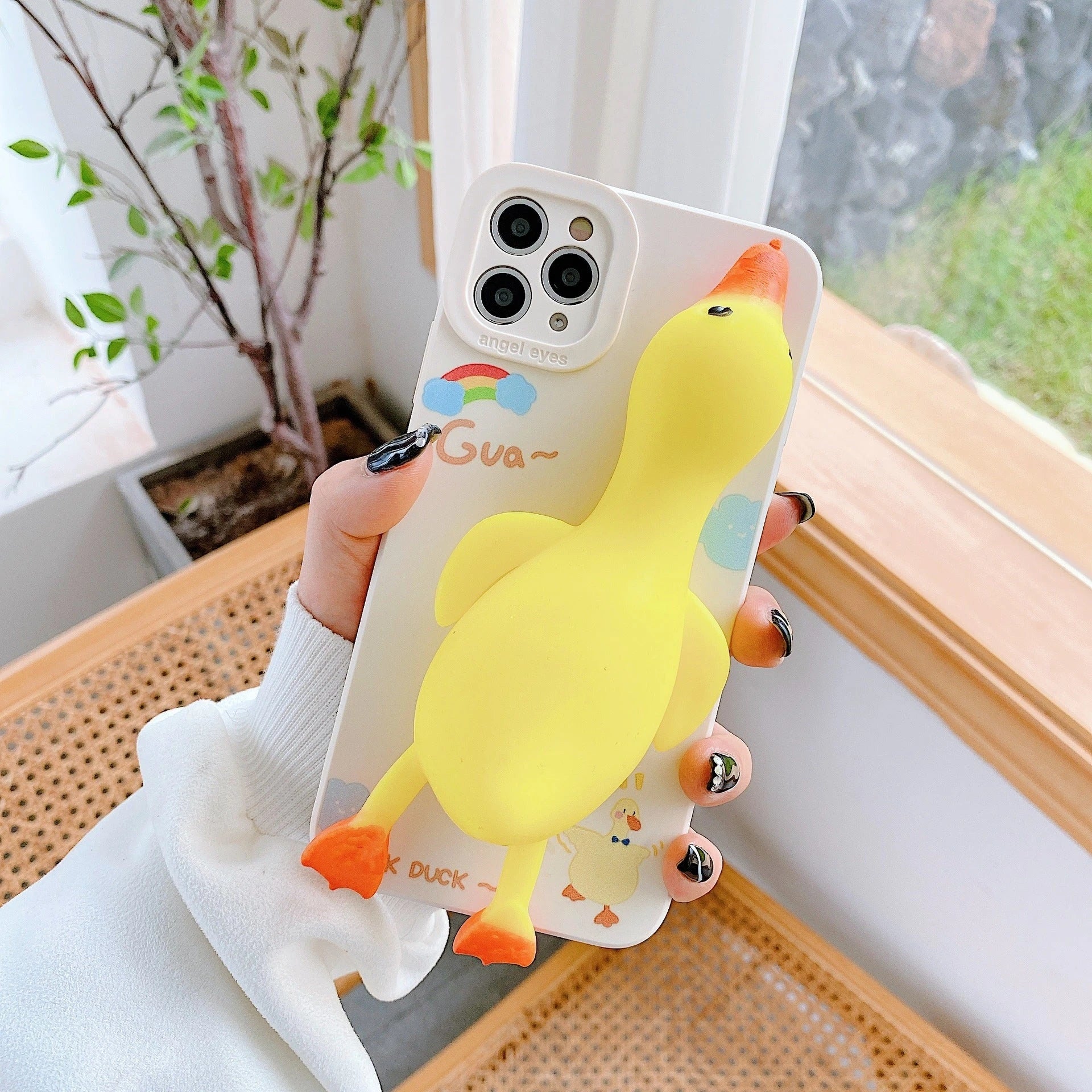 Stylish protective phone case with cartoon-inspired designs, compatible with a variety of iPhone models