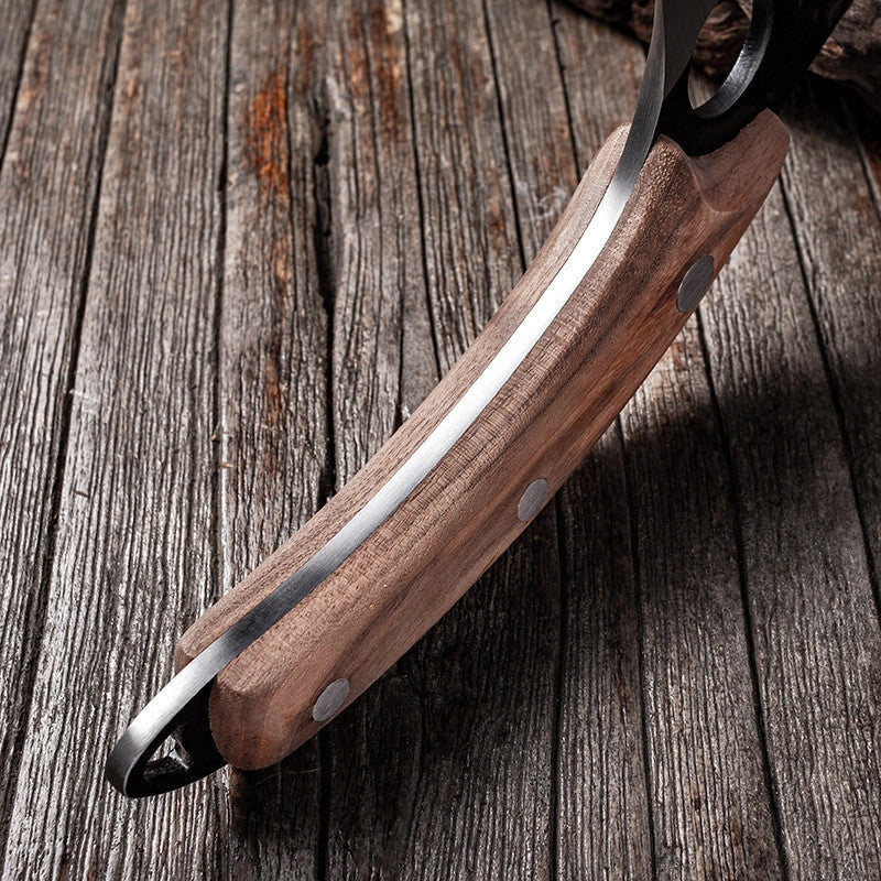 Versatile stainless steel scimitar knife with retro-inspired design, suitable for cutting and deboning meats and poultry