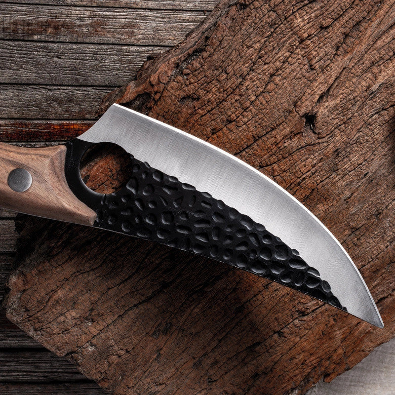 Versatile stainless steel scimitar knife with retro-inspired design, suitable for cutting and deboning meats and poultry