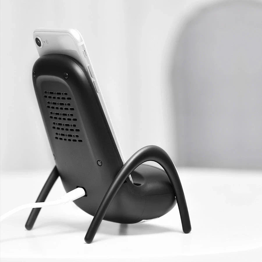 Wireless fast charging station with a stylish phone holder, designed for convenient and safe charging on a desk or table