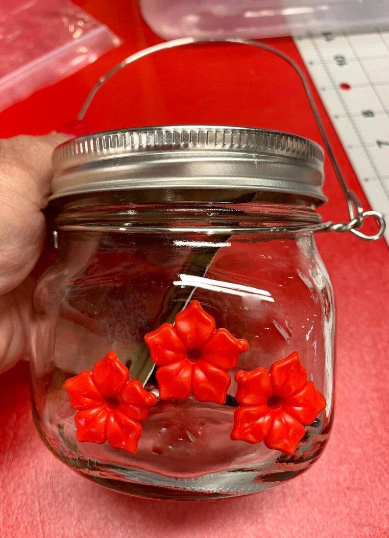 Charming hummingbird feeder with flower-shaped design, made of durable plastic for outdoor gardens and patios