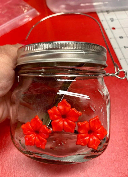 Charming hummingbird feeder with flower-shaped design, made of durable plastic for outdoor gardens and patios