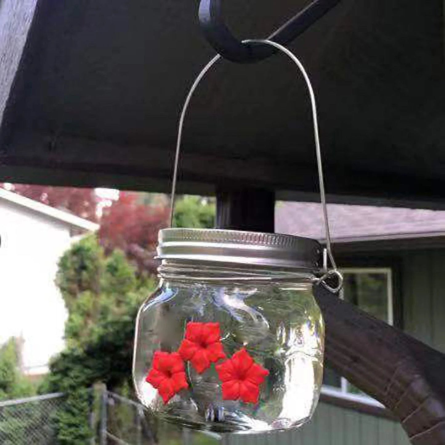 Charming hummingbird feeder with flower-shaped design, made of durable plastic for outdoor gardens and patios