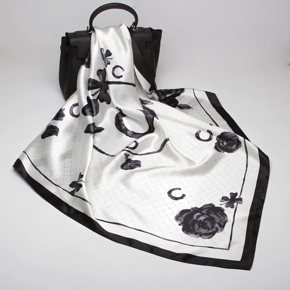 Square silk scarf with satin weave showing carriage chain pattern, measuring 90cm by 90cm