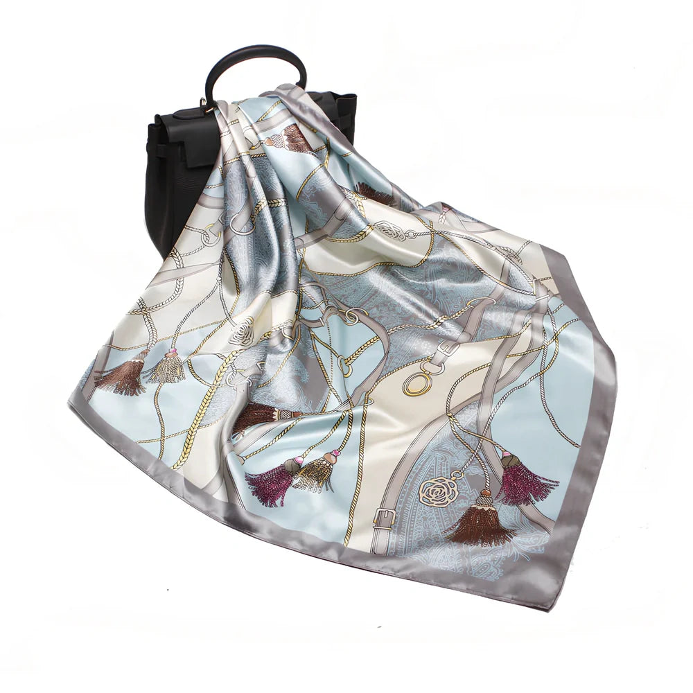 Square silk scarf with satin weave showing carriage chain pattern, measuring 90cm by 90cm