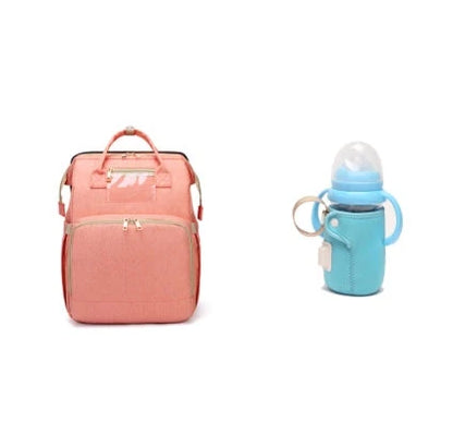 Versatile baby changing backpack with USB charging port and folding portable bed