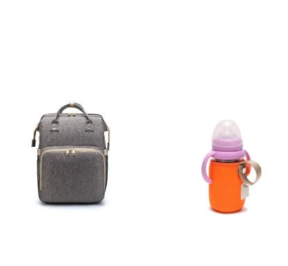 Versatile baby changing backpack with USB charging port and folding portable bed