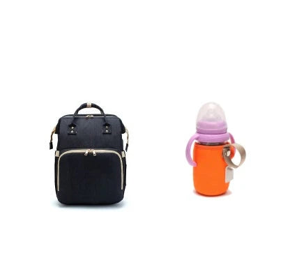 Versatile baby changing backpack with USB charging port and folding portable bed