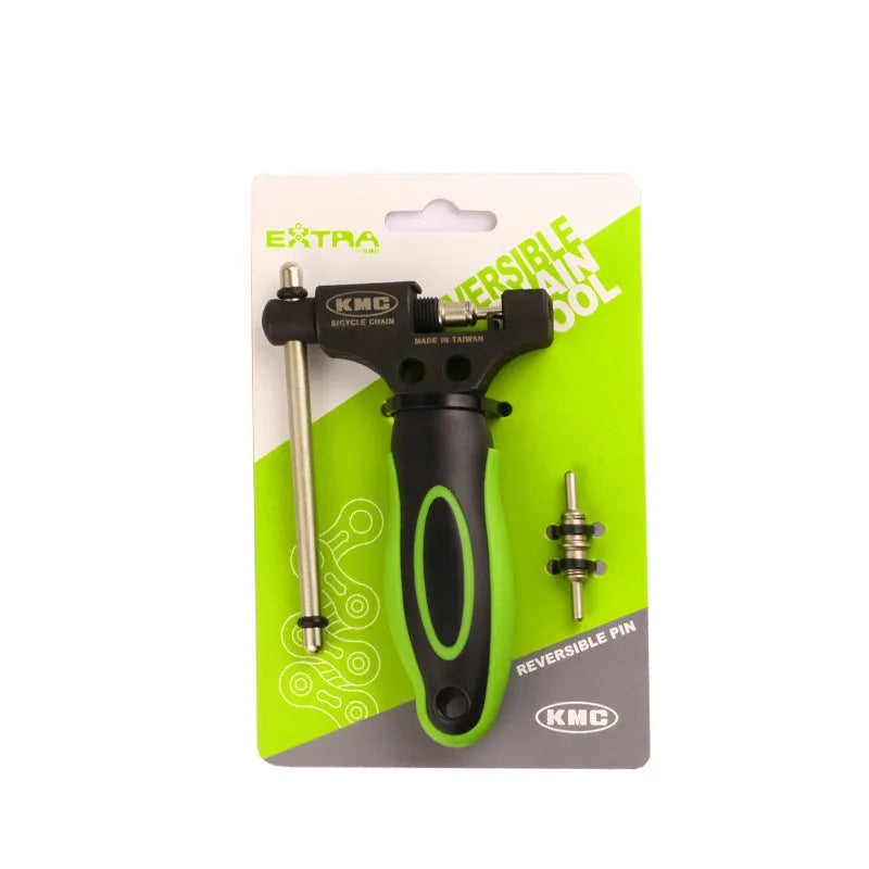 Green-handled steel bicycle chain tool with a double shaft chaining device on a white background.