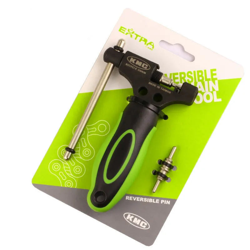 Green-handled steel bicycle chain tool with a double shaft chaining device on a white background.
