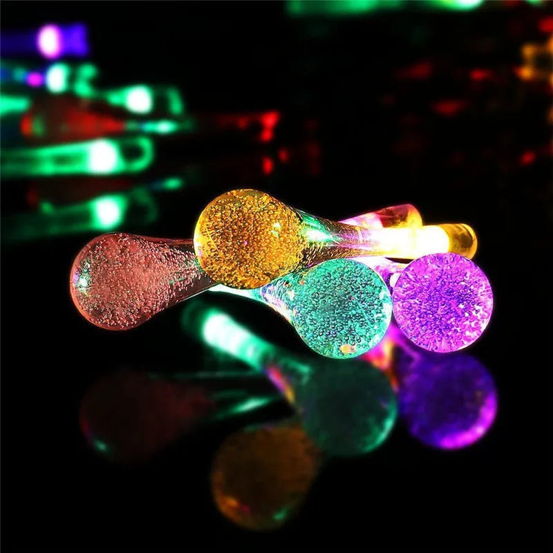 LED outdoor water drops solar string lights with bubble drop pendants on 6.5m cable, solar panel and ground spike included