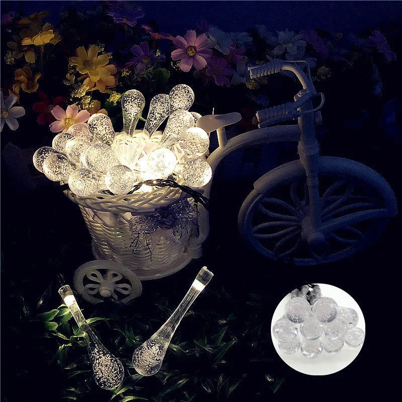 LED outdoor water drops solar string lights with bubble drop pendants on 6.5m cable, solar panel and ground spike included