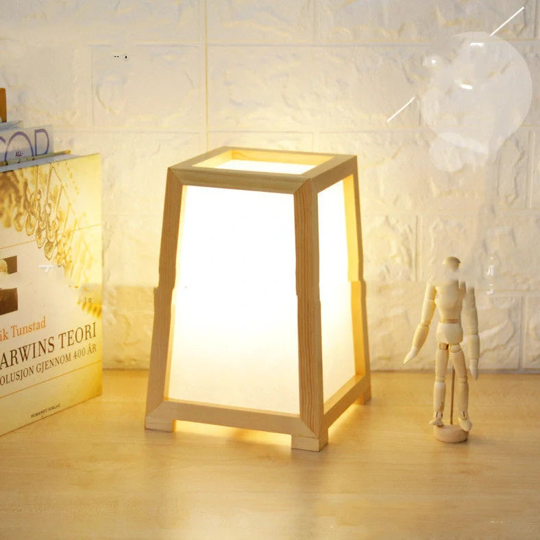 Bamboo wood table lamp with square base and dimmable LED lighting on wooden surface