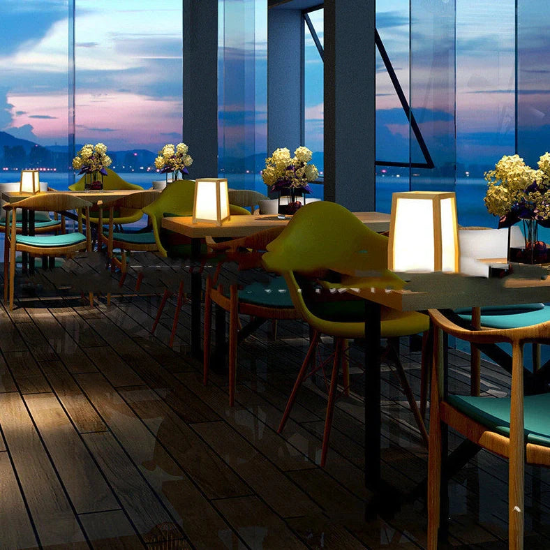 Bamboo wood table lamp with square base and dimmable LED lighting on wooden surface