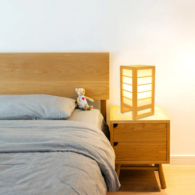 Simple solid wood bedside lamp with a natural bamboo wood base and a push-button switch on the cord.