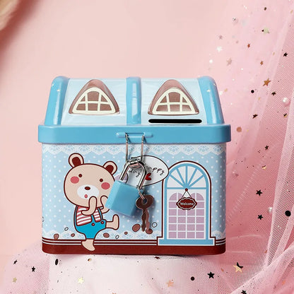 Blue house shaped tinplate piggy bank on desktop with coin slot