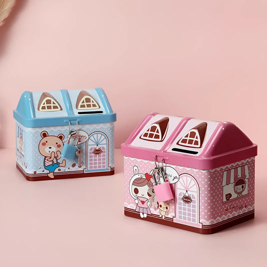Blue house shaped tinplate piggy bank on desktop with coin slot