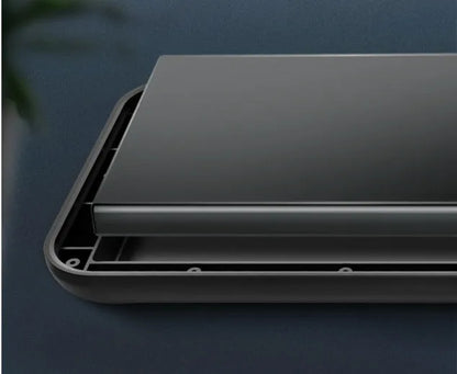 Black ultra-thin wireless back clip battery pack attached to an iPhone 12 phone in a soft TPU case.