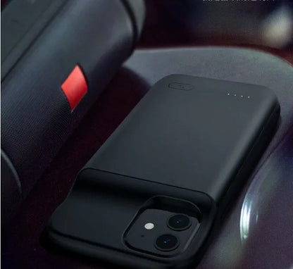 Black ultra-thin wireless back clip battery pack attached to an iPhone 12 phone in a soft TPU case.