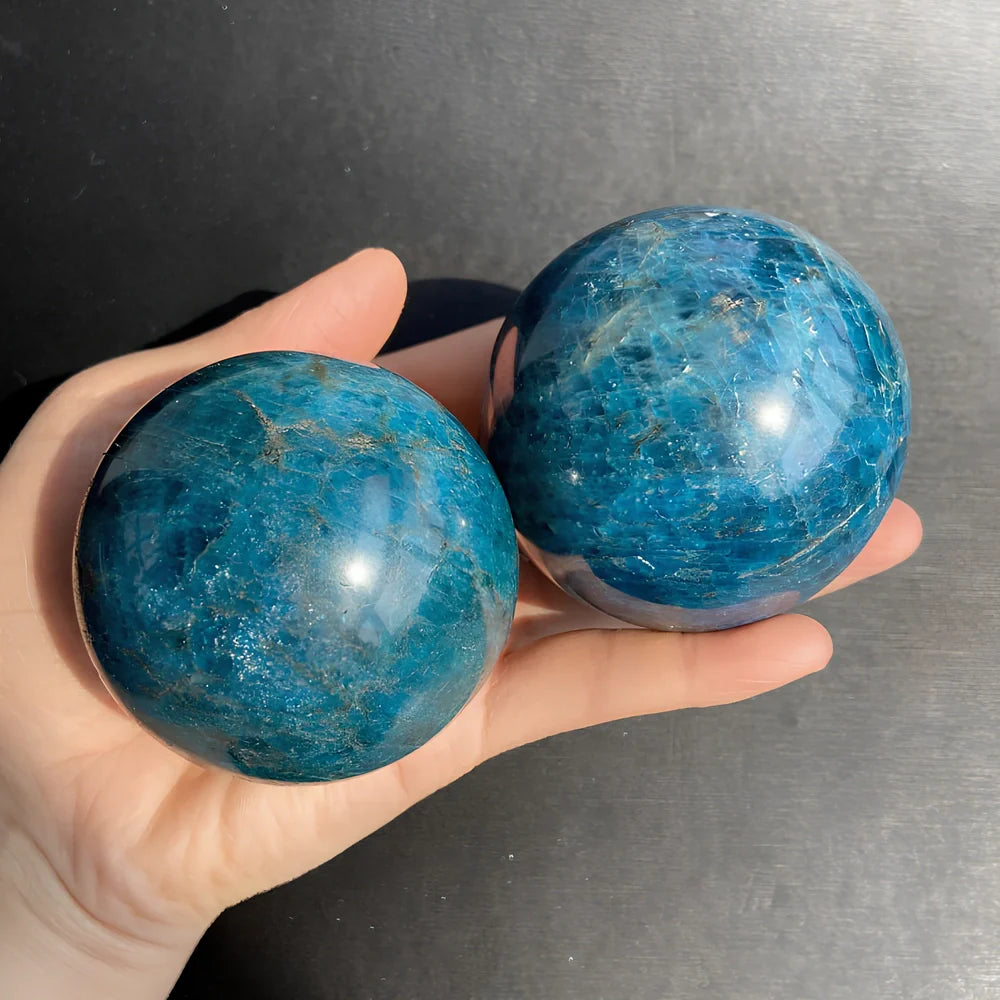 Natural blue apatite crystal ball showing spherical form with genuine mineral texture and colour variations
