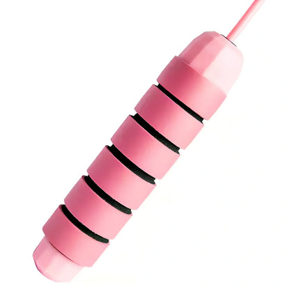 Pink and grey skipping rope with weighted handles and adjustable length mechanism for fitness training