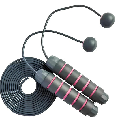 Pink and grey skipping rope with weighted handles and adjustable length mechanism for fitness training