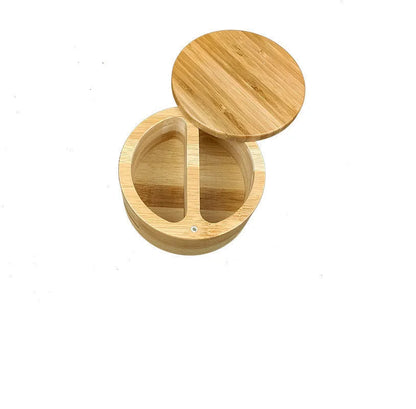 Bamboo seasoning box and spoon set for solid spices on a kitchen counter.