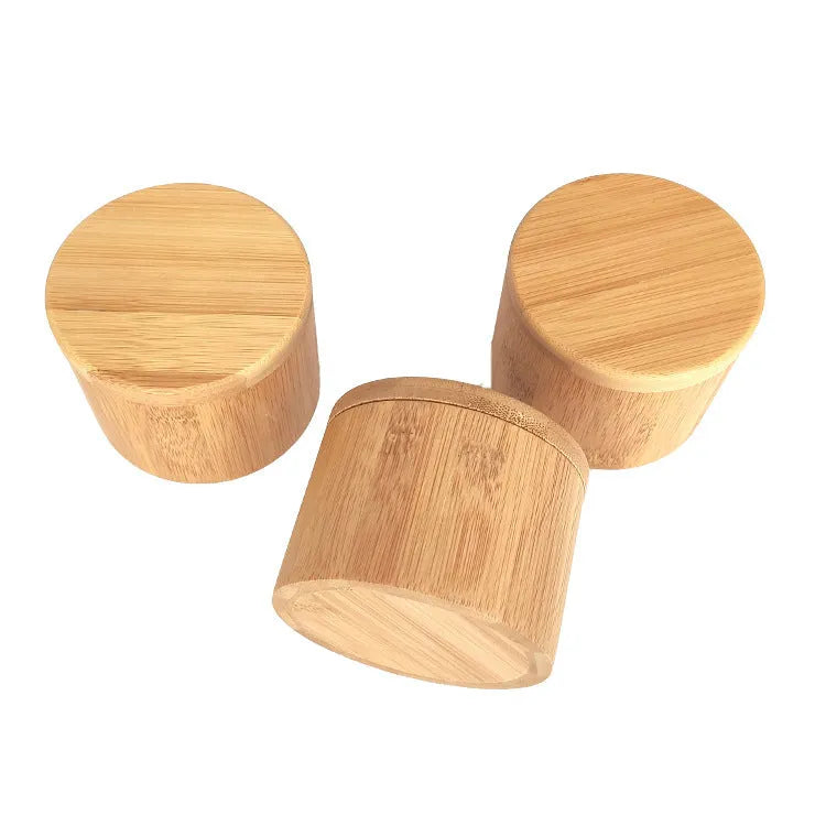 Bamboo seasoning box and spoon set for solid spices on a kitchen counter.