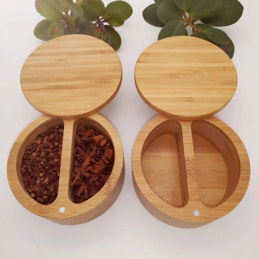 Bamboo seasoning box and spoon set for solid spices on a kitchen counter.