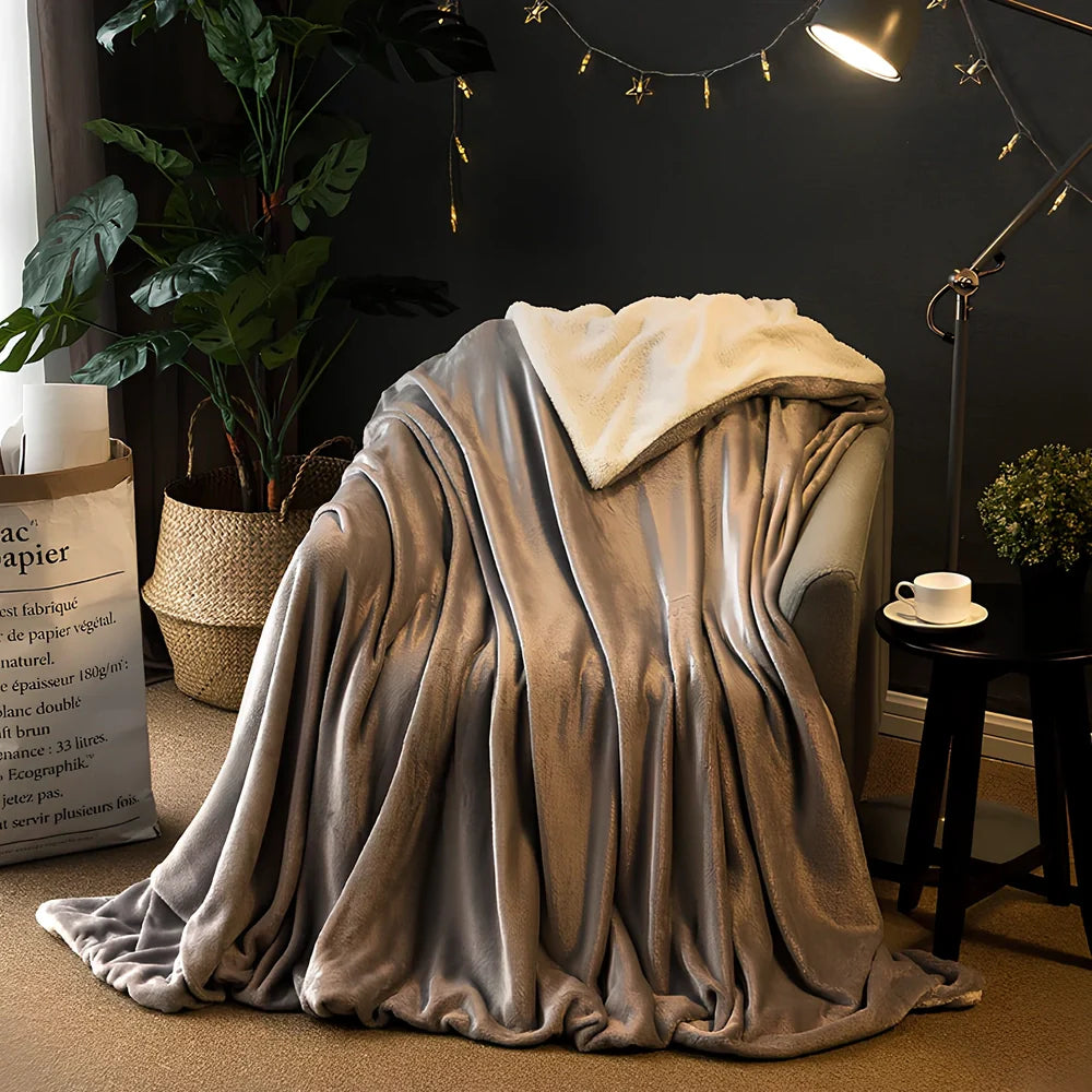 Brown flannel blanket with 170g weight measurement shown on sofa, demonstrating size coverage and texture detail