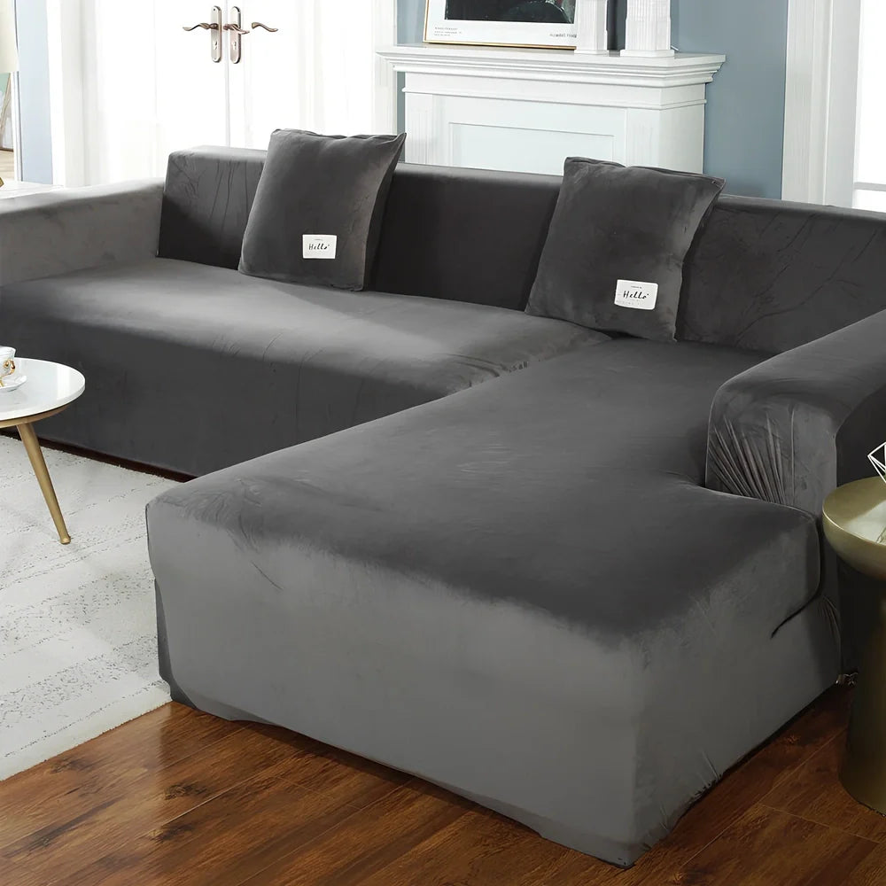Silver Fox Velvet elastic sofa cover stretched over grey sofa showing fitted appearance