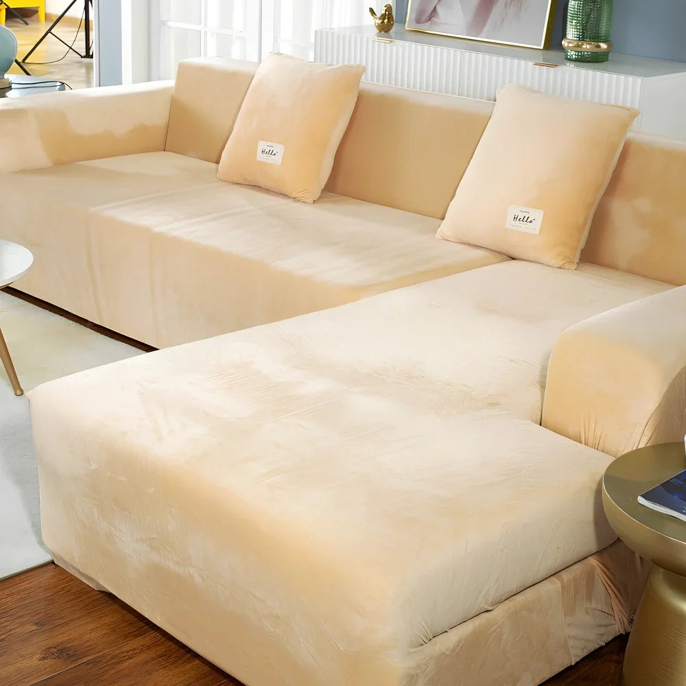 Silver Fox Velvet elastic sofa cover stretched over grey sofa showing fitted appearance