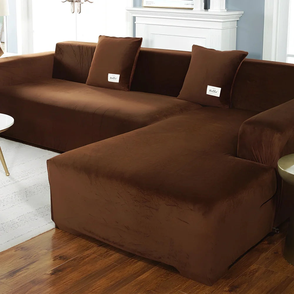 Silver Fox Velvet elastic sofa cover stretched over grey sofa showing fitted appearance