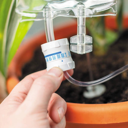 Drip irrigation watering bag for indoor plants, featuring a slow-release water system and compact, sustainable design.