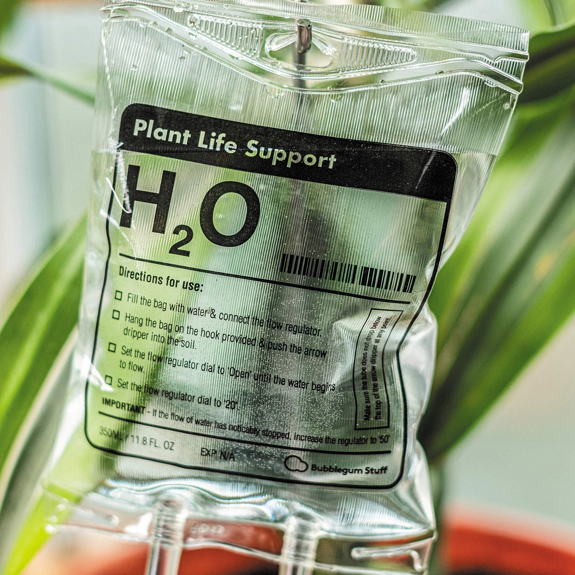 Drip irrigation watering bag for indoor plants, featuring a slow-release water system and compact, sustainable design.