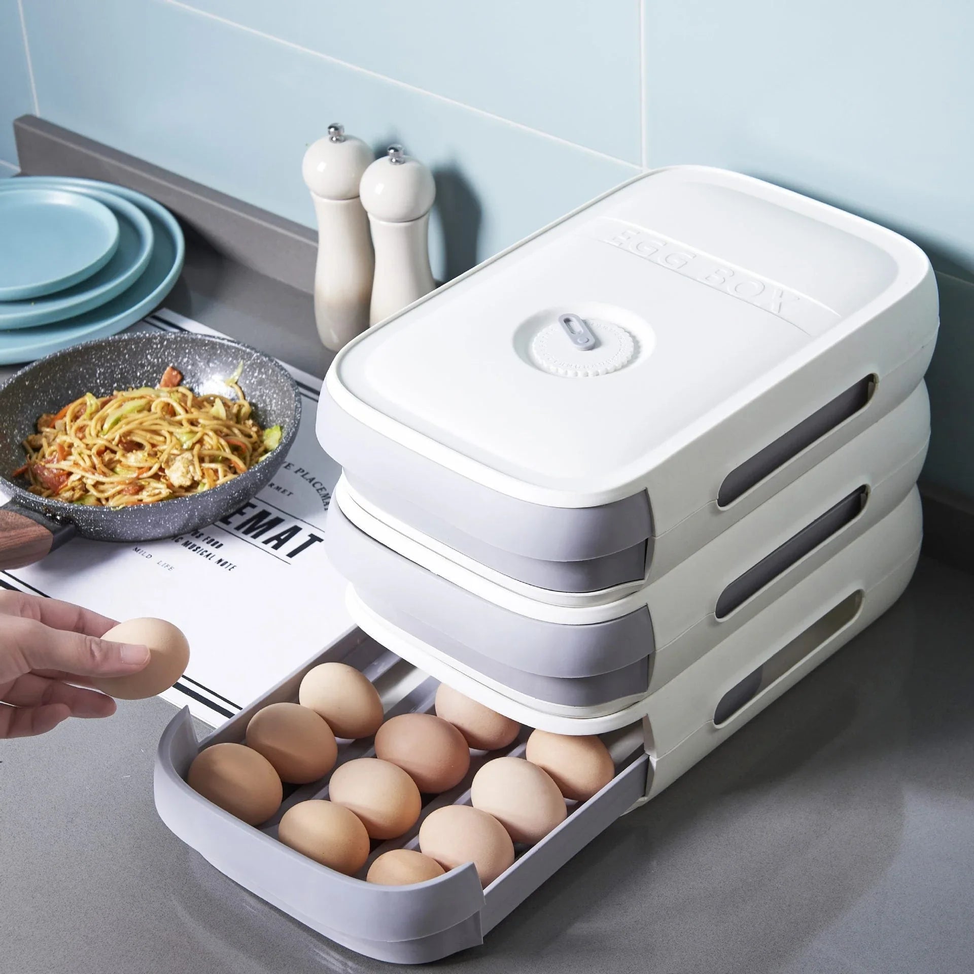 Versatile Drawer Egg Storage Box with breathable mesh design, overlapping layers, and compact drawer-style construction for organized refrigerator storage