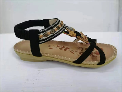 Fashionable floral rhinestone sandals with a durable rubber sole and supple PU upper for comfortable style.