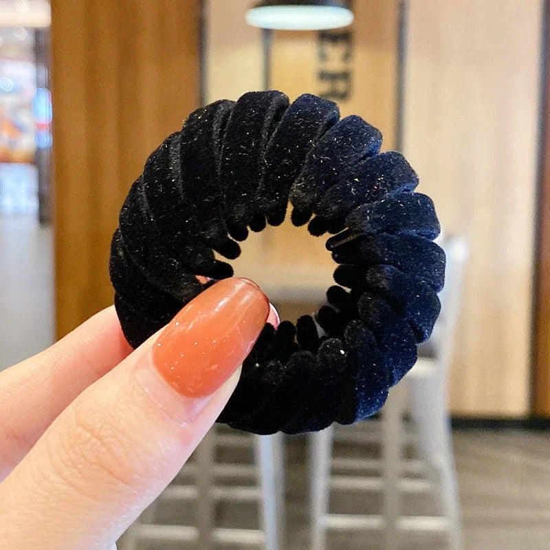 Adjustable ponytail hair accessory with flexible teeth, available in various colors, designed for easy, natural-looking hairstyles