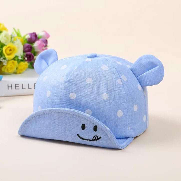 Baby wearing navy blue baseball cap with short brim, dome top design for children 6-24 months