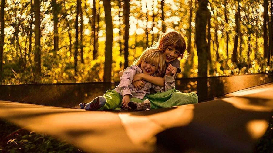 Spacious multi-person hammock with 3-point suspension system, ideal for outdoor adventures and backyard relaxation.