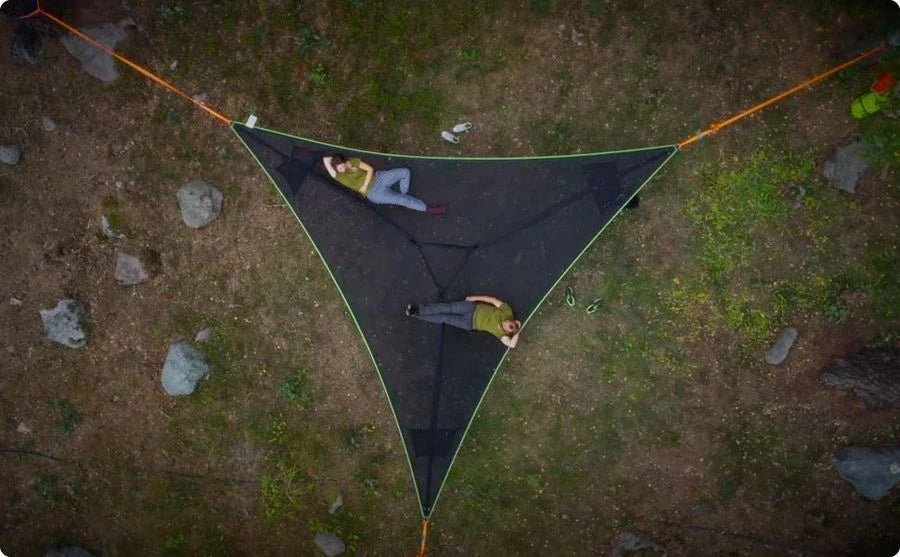Spacious multi-person hammock with 3-point suspension system, ideal for outdoor adventures and backyard relaxation.