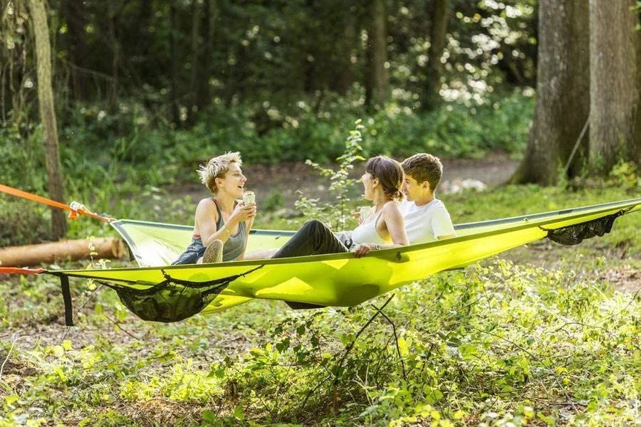 Spacious multi-person hammock with 3-point suspension system, ideal for outdoor adventures and backyard relaxation.