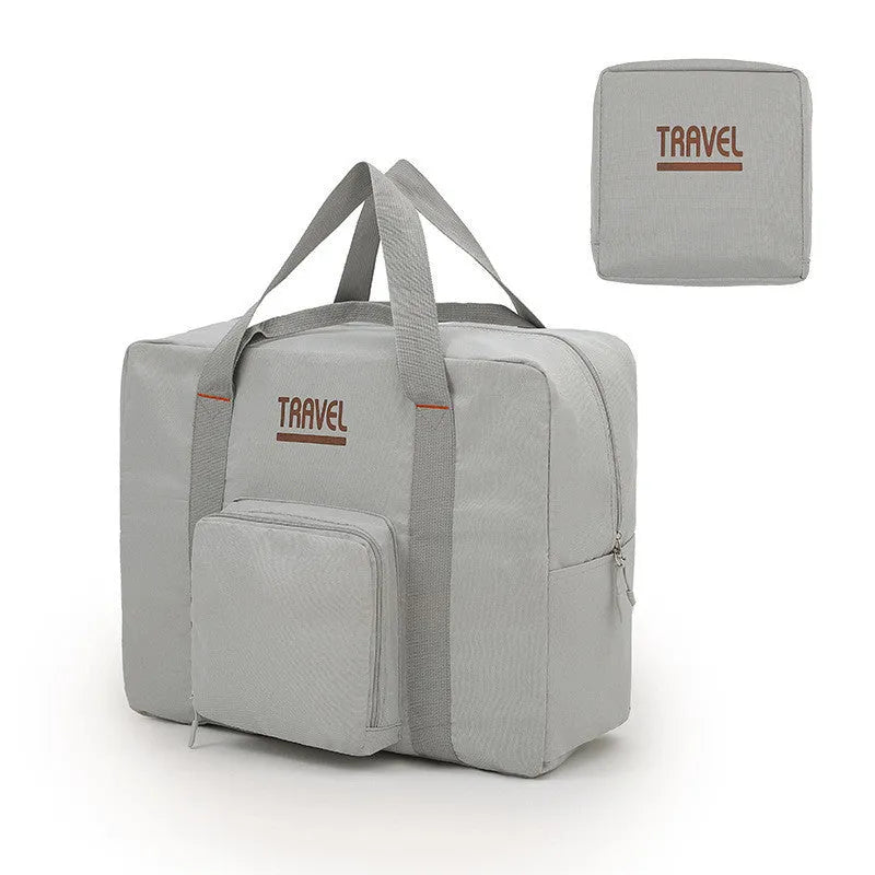 Cube-shaped travel bag with compression seal in Oxford cloth, shown in khaki colour with clothing items inside