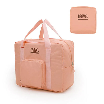 Cube-shaped travel bag with compression seal in Oxford cloth, shown in khaki colour with clothing items inside