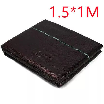 Black composite woven PE weed prevention cloth laid flat on soil.