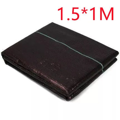 Black composite woven PE weed prevention cloth laid flat on soil.