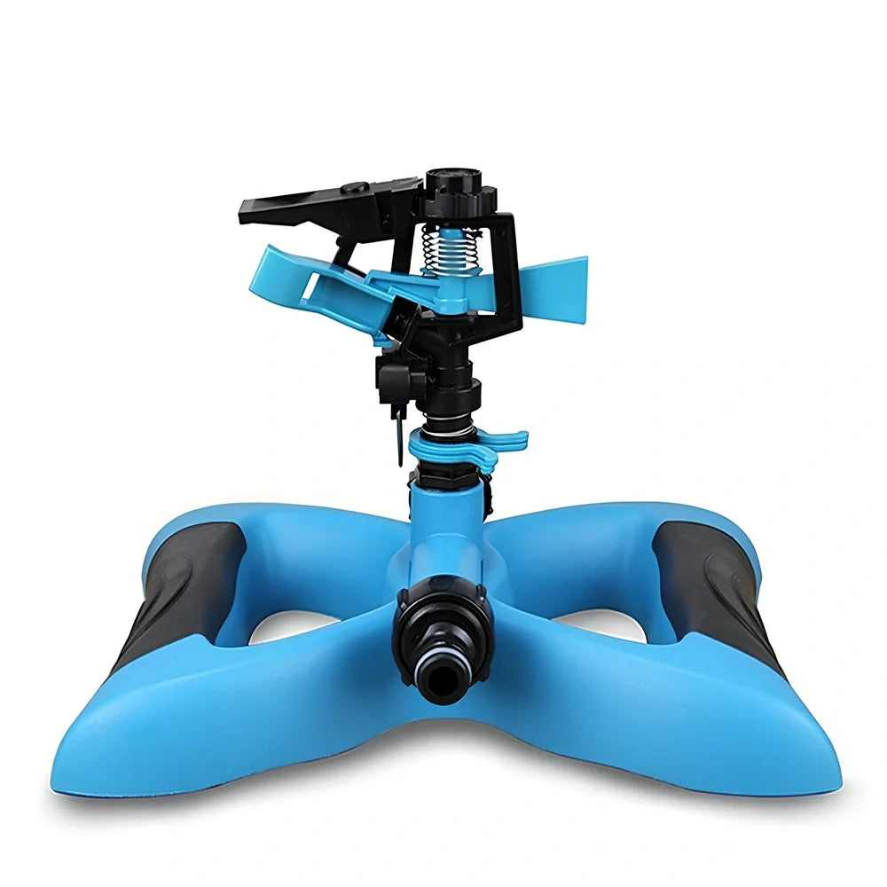 Blue butterfly-shaped garden sprinkler with rotating nozzle on grass