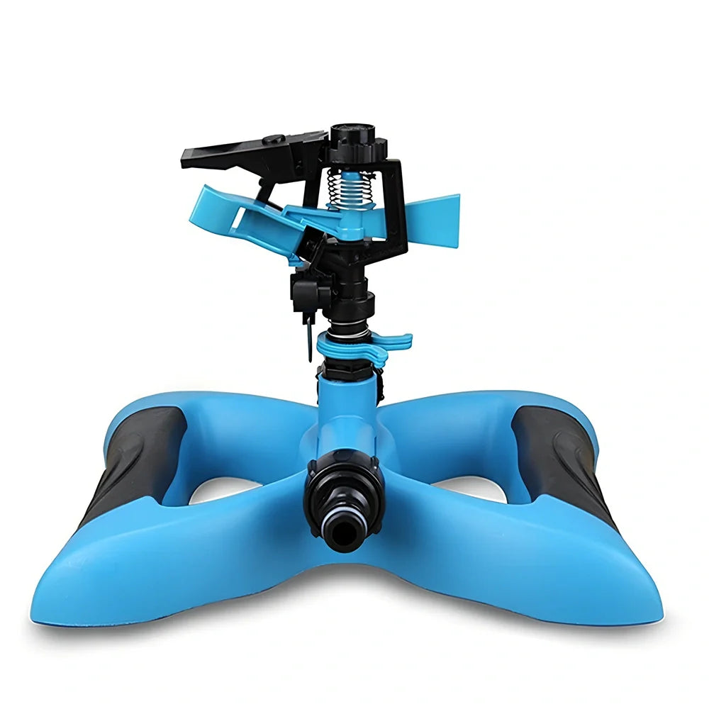 Blue butterfly-shaped garden sprinkler with rotating nozzle on grass