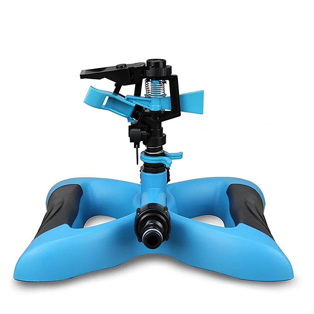 Blue butterfly-shaped garden sprinkler with rotating nozzle on grass
